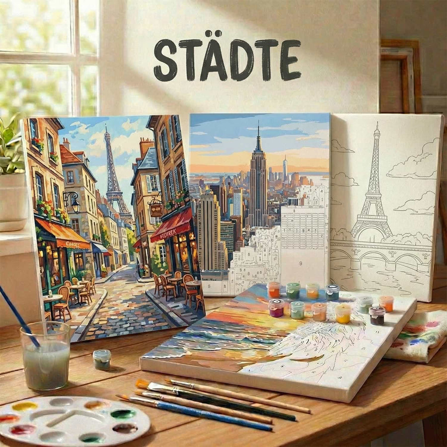 Painting of a cityscape on a white brick wall above a gray sofa with pillows in a modern living room.