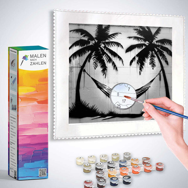 Paint by Numbers kit Tropical Calm Black and White with paint pots and brush, featuring a tranquil scene of palm trees and hammock.