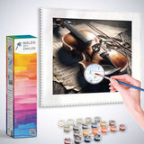 Person Painting Violin at Dawn with Malen nach Zahlen Kit Featuring Paints and Brushes