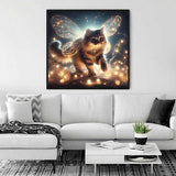 Fairy cat art print displayed in modern living room with white sofa and stylish plants