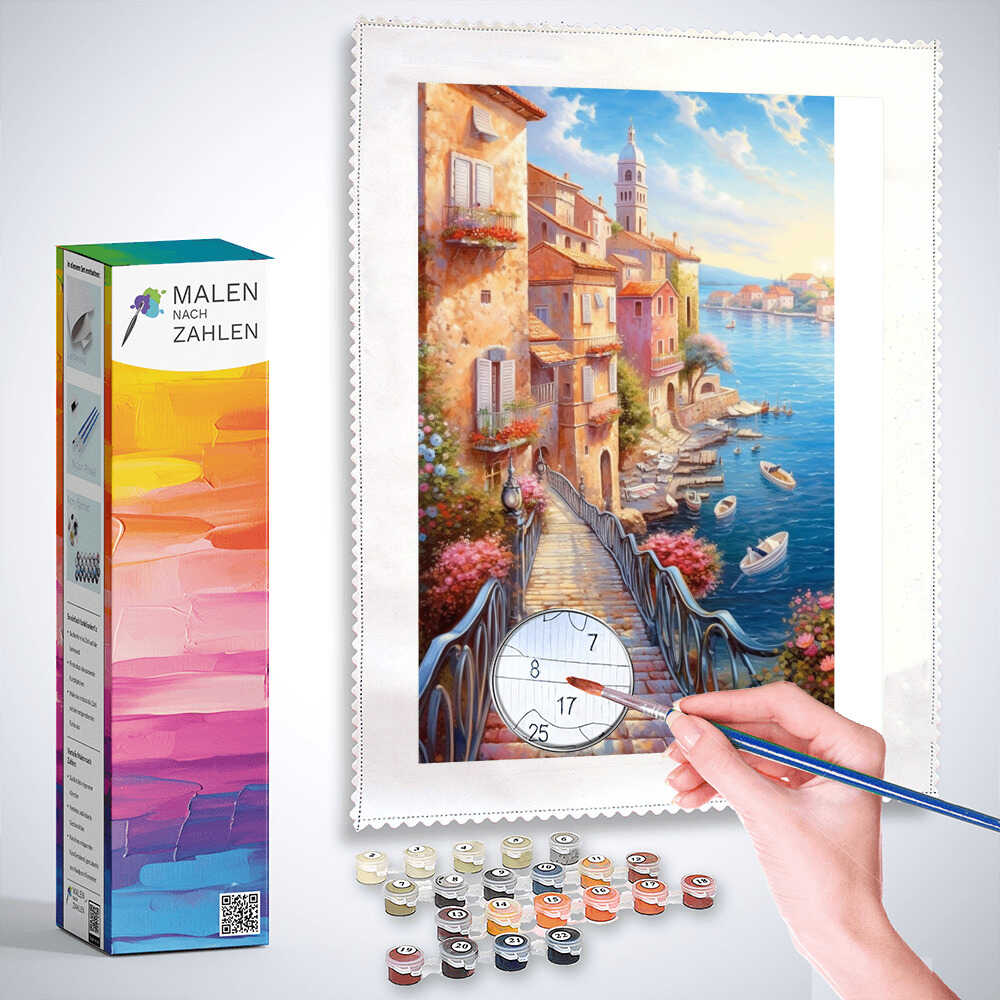 Malen nach Zahlen Set - Mediterranes Idyll, Meeresbrücke with pastel houses, boats, flowers, and an artist's hand painting.