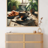 Wall art of steaming coffee cup and croissant on rustic table with greenery, displayed above wicker sideboard in modern room