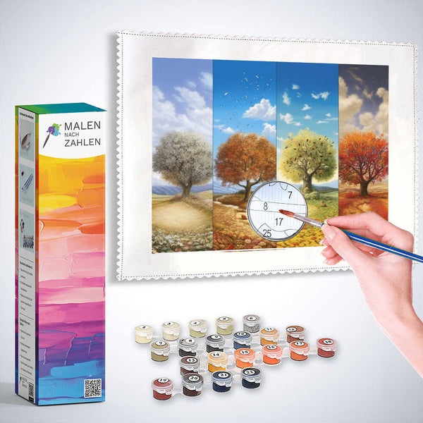 Malen nach Zahlen - Jahreszeiten der Sinne Set mit farbenprächtigem Panorama der vier Jahreszeiten, Hand hält Pinsel, Farben im Vordergrund