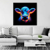 Neon cow painting hanging on wall above white sofa in stylish living room with plants and decor elements