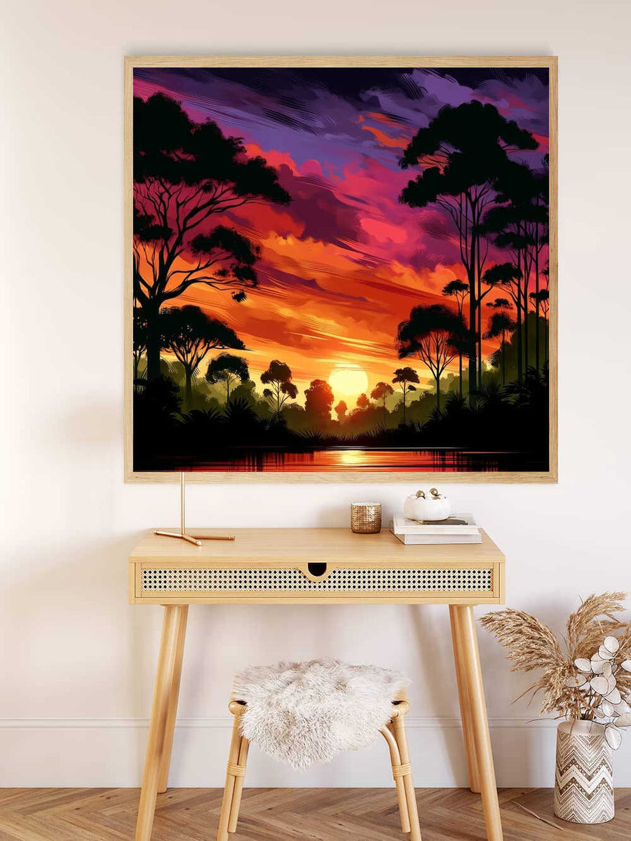 Malen nach Zahlen Leinwand mit einem farbenfrohen Sonnenuntergang im Geheimen Wald, aufgehängt über einem Schreibtisch mit Dekor.