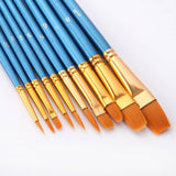 Set of blue-handled paintbrushes with gold ferrules arranged in a row