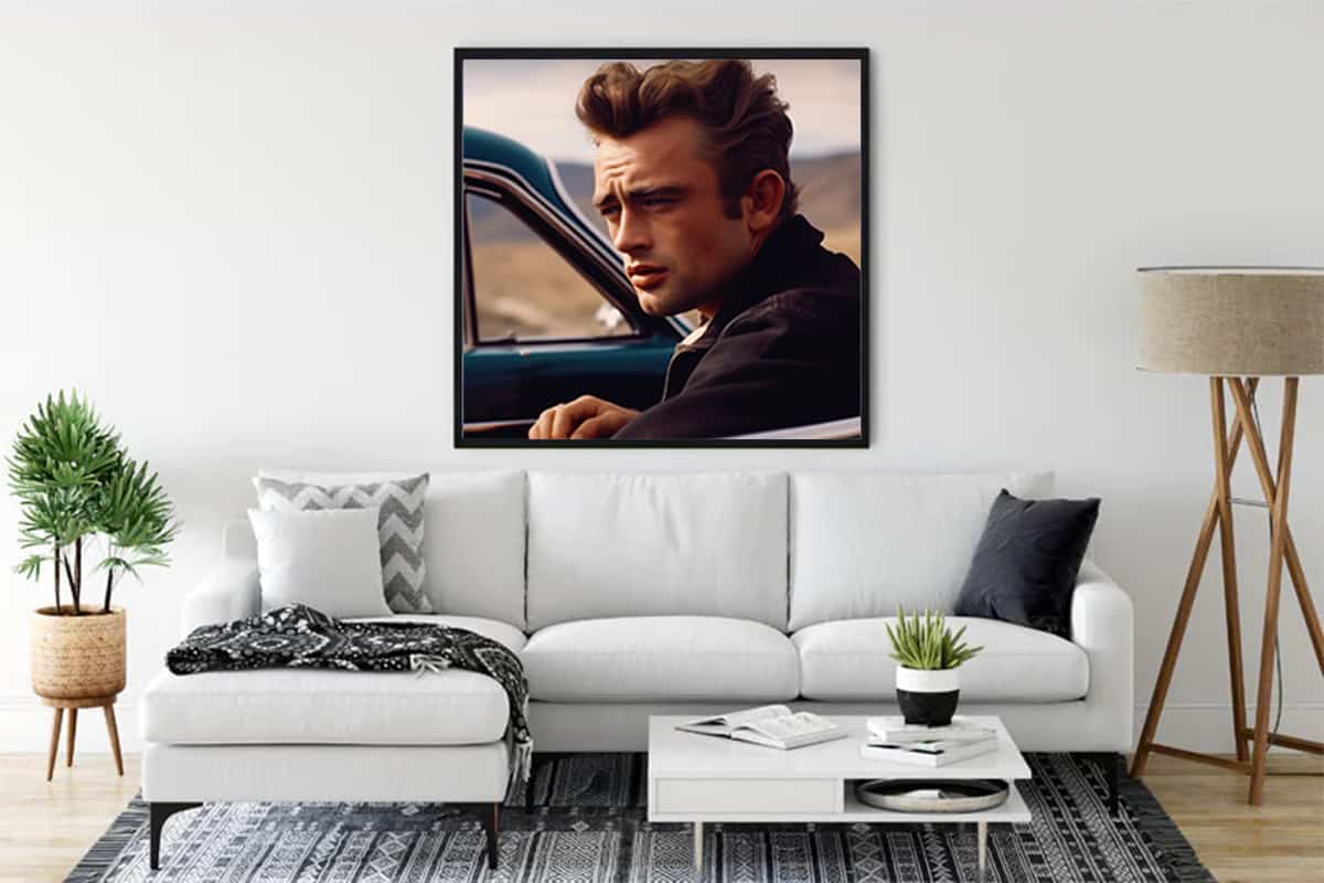 Modern living room with a James Dean painting, featuring stylish decor and a comfortable white couch.