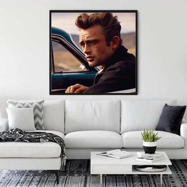 Modern living room with a James Dean painting, featuring stylish decor and a comfortable white couch.