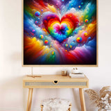 Bright colorful abstract love painting with rainbow heart, displayed above a wooden desk with a stool and decorative items.