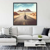 Living room with a framed painting of a motorcyclist on a highway, capturing the essence of freedom and adventure.