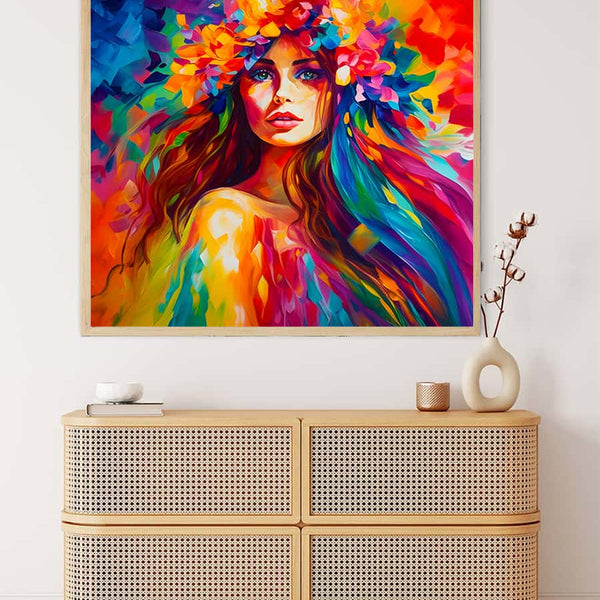 Colorful woman painting displayed above a beige woven cabinet with minimalistic decor.