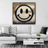 Stylish living room with a white sofa, gray accents, and a wall art featuring a smiling face in a black frame above the couch