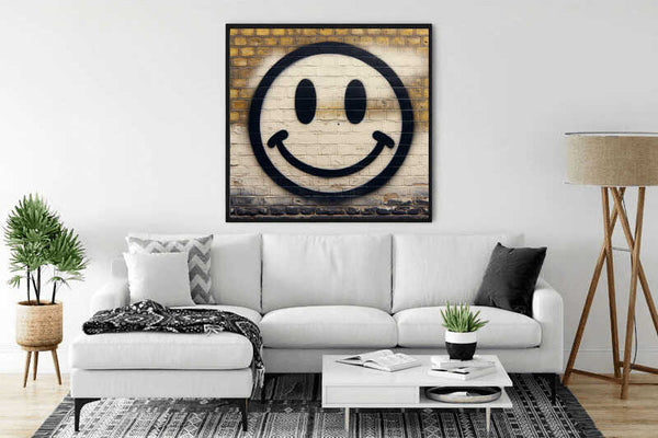 Stylish living room with a white sofa, gray accents, and a wall art featuring a smiling face in a black frame above the couch