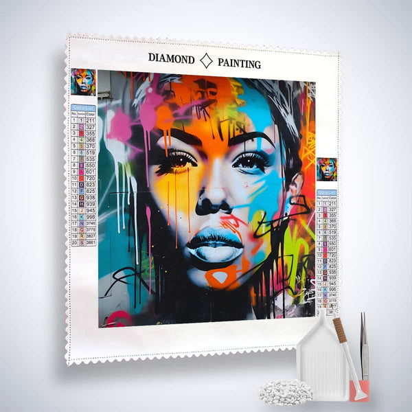Diamond painting kit "Frau Sprayart" with colorful face art on professional canvas, acrylic diamonds, tweezers, and tools.
