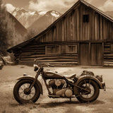 Retro motorcycle in front of a rustic wooden cabin with mountains in the background