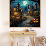 Halloween Nights paint by numbers scene with moonlit haunted houses and glowing pumpkins displayed on wall above a desk.