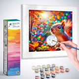 Person painting colorful and magical forest scene with squirrel using Malen nach Zahlen kit. Box, paint pots, and brush included.