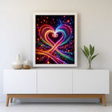 Diamond Painting - Doppelherz featuring intertwined neon hearts with vibrant colors, symbolizing love and harmony, displayed above a modern white cabinet.