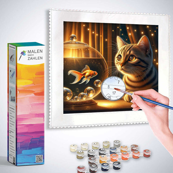 Diamond painting set of a curious striped cat staring at a goldfish in an aquarium during warm dusk with labeled paint pots and brush.