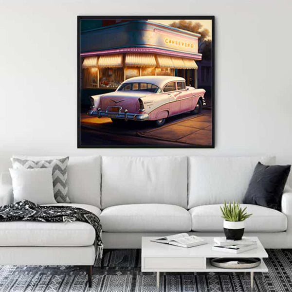 Living room with a 1950s gas station painting on the wall, showcasing a vintage car and retro vibes.