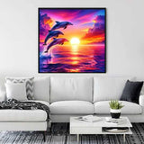 Painting of dolphins leaping over the ocean at sunset hanging above a white couch in a modern living room.