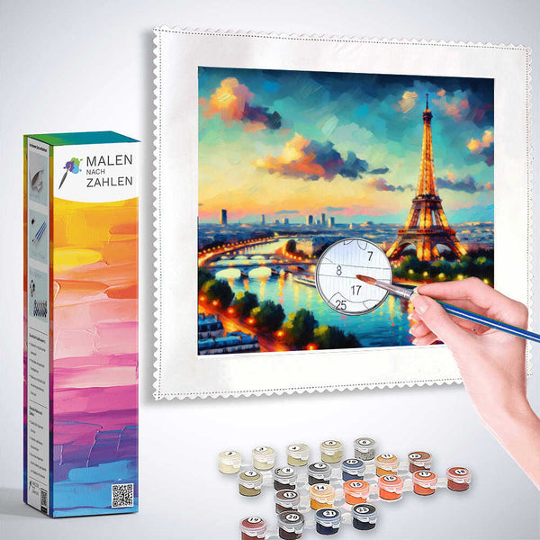 Painting by numbers kit showing an evening scene of Paris with Eiffel Tower, colorful sky, and paint supplies.