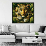 Diamond Painting - Leopard Portrait elegantly displayed above a stylish white sofa in a modern living room.