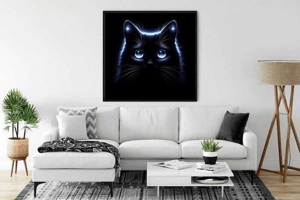 Modern living room with white sofa and neon glow dark cat wall art.