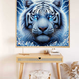 Diamond Painting of Schöner Schneetiger with icy blue mane and sparkling diamond eyes, creating a mystical stormy atmosphere.