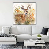 Painting of a deer in autumn forest displayed in a modern living room with white sofa and black and white decor