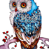 Colorful wooden owl puzzle piece perched on a tree branch with intricate laser-cut designs.