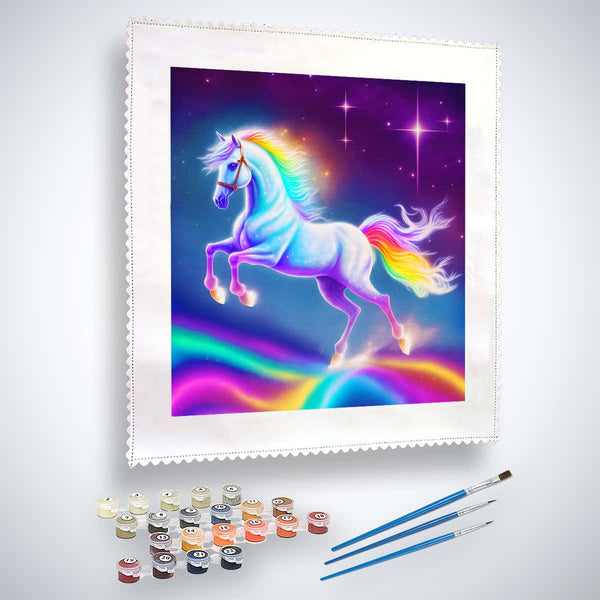 Paint by numbers kit featuring a unicorn on a rainbow with paintbrushes and paint pots included.