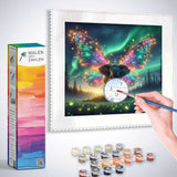 Painting a numbered canvas of a magical butterfly with Malen nach Zahlen kit Feenstaub und Sternenreise and paints.