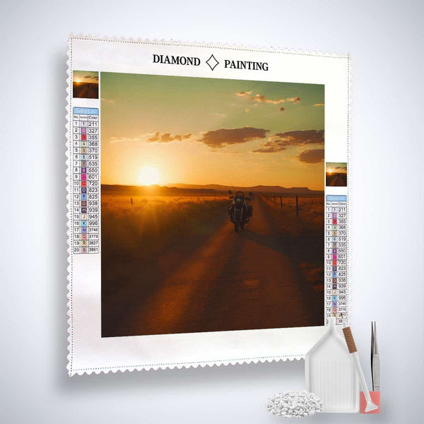 Diamond Painting Kit - Rebellische Maschine with sunset landscape, canvas, acrylic diamonds, tweezers, and set tool.