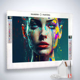 AB Diamond Painting - Trauerregen kit with acrylic diamonds, canvas, artist tweezers, and setting pen shown with a vibrant painted face motif.