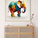 Colorful geometric elephant paper art painting displayed above a wooden chest in a modern decor setting.