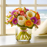 Vase with vibrant mixed flowers on a windowsill overlooking a beach.