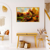 Painting of serene lakeside house with floral pathway on living room wall
