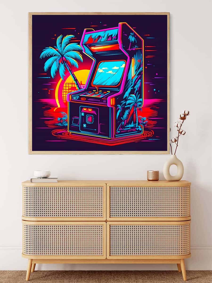 Neon-themed painting of an arcade machine with palm trees and a sunset, mounted above a wicker cabinet in a modern interior setting.