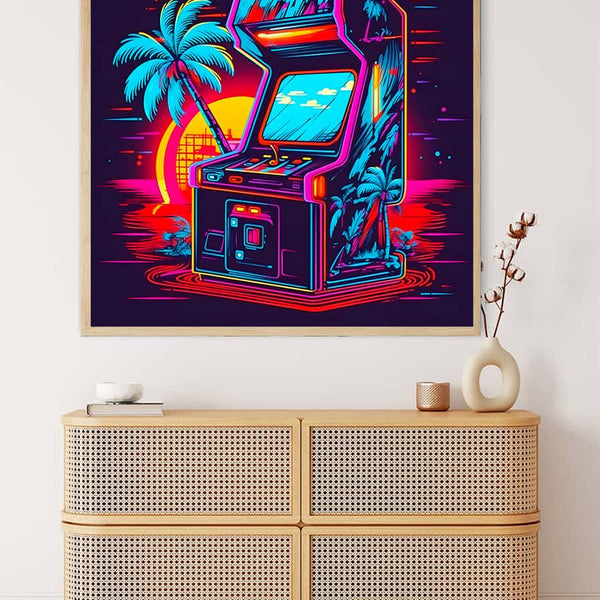 Neon-themed painting of an arcade machine with palm trees and a sunset, mounted above a wicker cabinet in a modern interior setting.