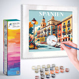Painting by numbers kit depicting vibrant Mediterranean street scene titled 'Spanien' with colorful buildings.