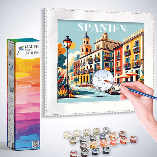 Painting by numbers kit depicting vibrant Mediterranean street scene titled 'Spanien' with colorful buildings.
