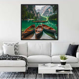 Wall art with boats and mountain panorama in a serene lake scene displayed in a modern living room.