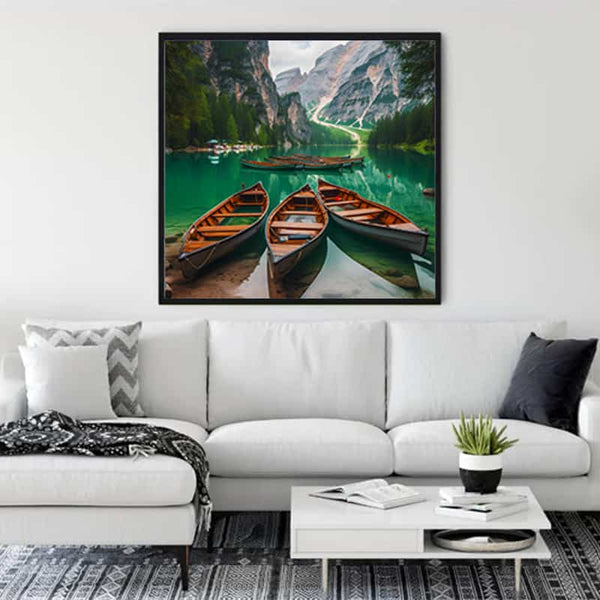 Wall art with boats and mountain panorama in a serene lake scene displayed in a modern living room.
