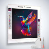 AB Diamond Painting of a colorful flying hummingbird with vibrant acrylic diamonds, professional canvas, tweezers, and set tools.