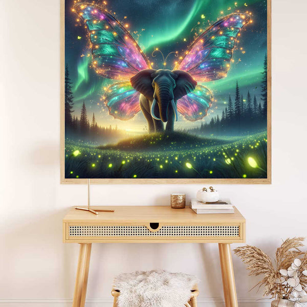 Painting by numbers artwork featuring a luminous butterfly-elephant hybrid against a starry night sky, hung above a modern desk.