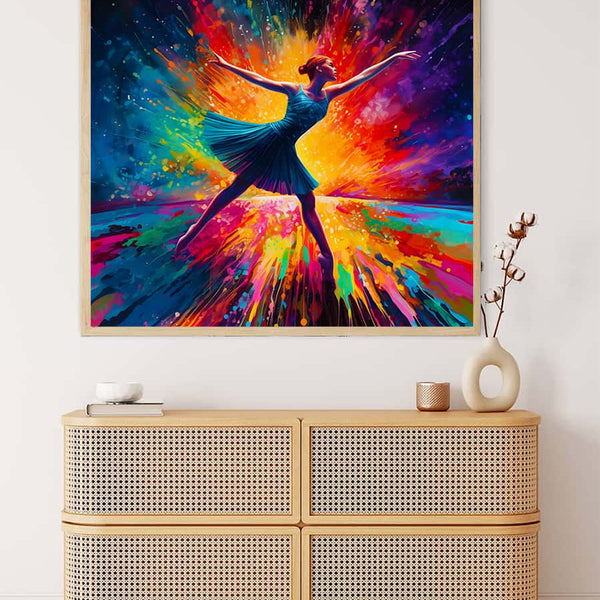AB Diamond Painting Bunter Tanz – vibrant artwork of a dancing figure with colorful acrylic diamonds on a canvas displayed above a cabinet.