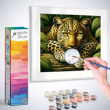 Diamond painting kit with leopard portrait among lush leaves, showcasing realistic golden and ochre fur with vivid green background