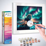 Painting by Numbers kit with a majestic lion under the Northern Lights, featuring paints, brushes, and a framed canvas illustration.