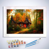 Malen nach Zahlen Set - Spitzdachhaus im herbstlichen Wald mit Farben und Pinseln.